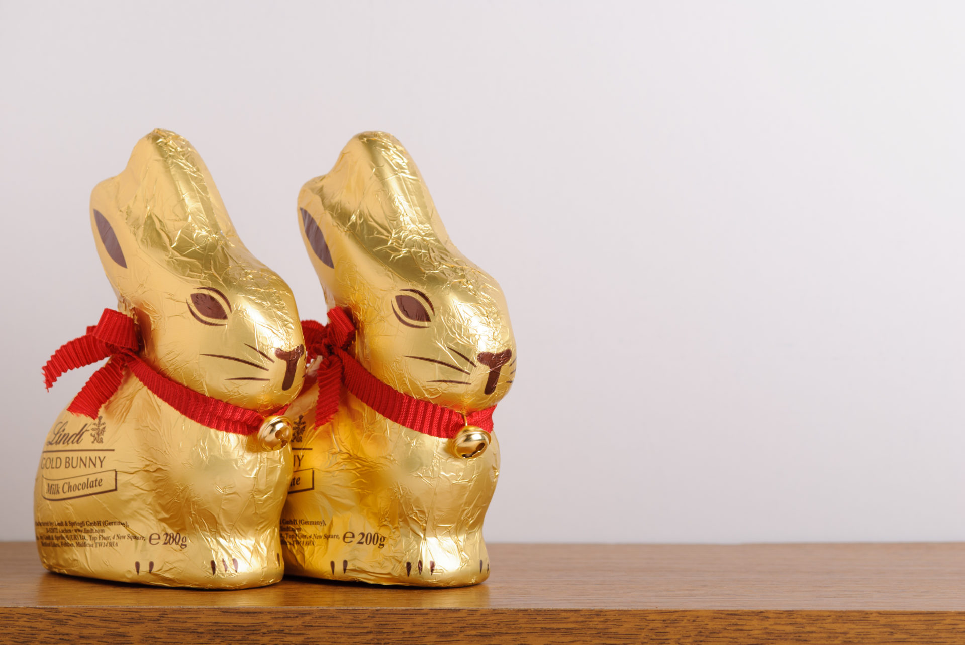 Two Lindt Easter Gold Bunnies on Shelf