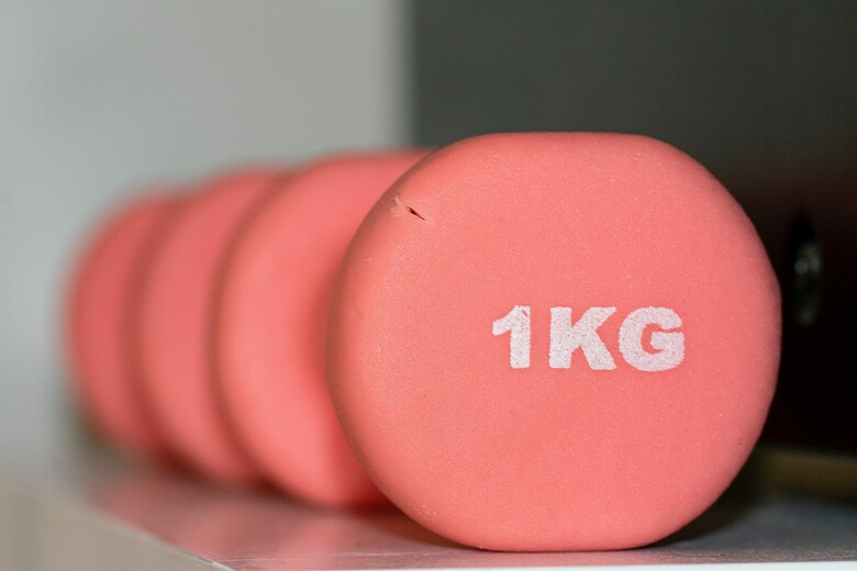 Two pink dumbbells