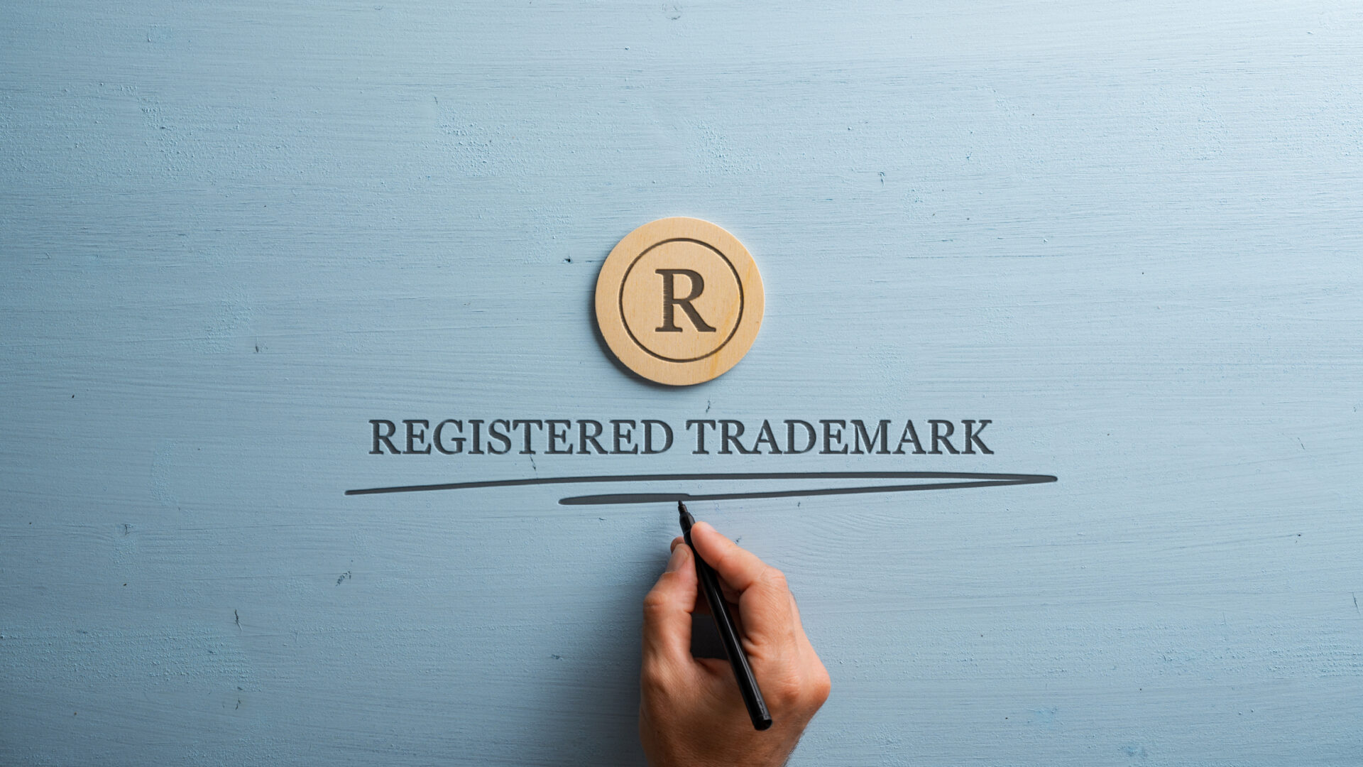 Kuva, jossa R-kirjain ja lukee "Registered Trademark".