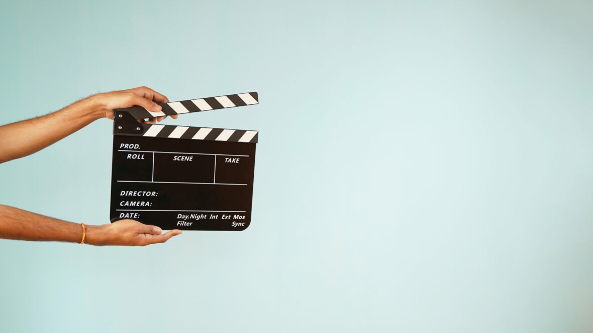 Hand is holding clapper board