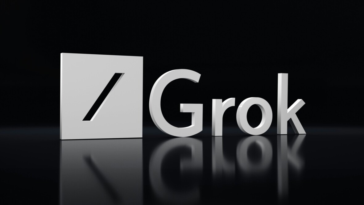 Grok merkin logo valkoisena mustalla taustalla. Logo heijastuu haaleasti alaspäin.