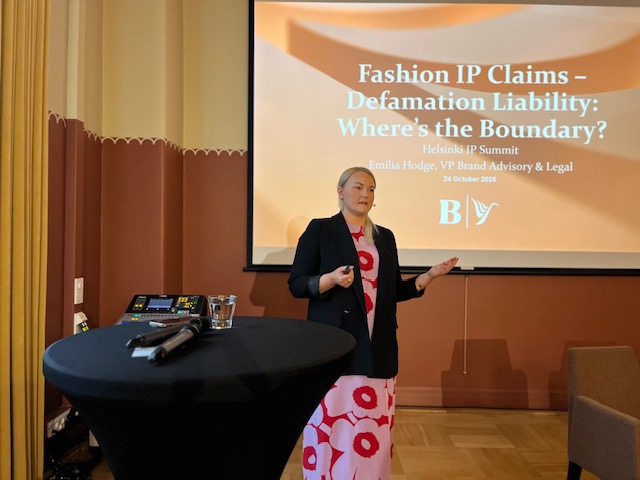 Picture of a woman giving a presentation.